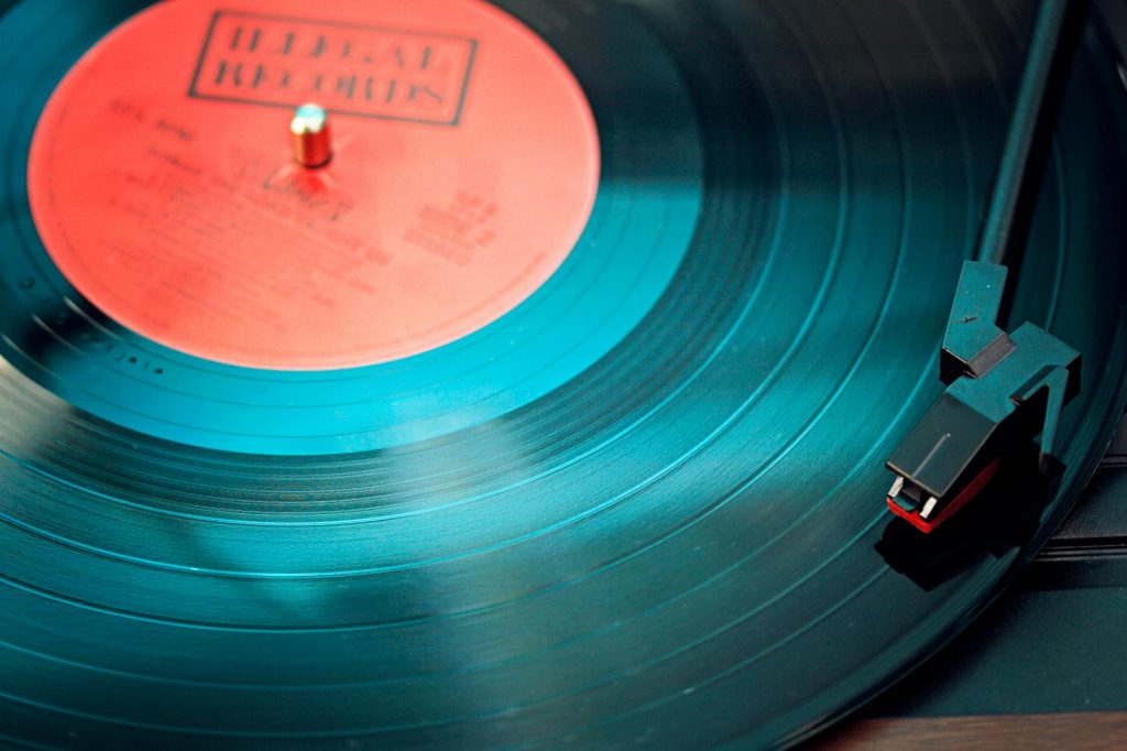 blue vinyl record playing on turntable